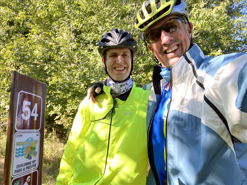 Bikers and Trail Sign